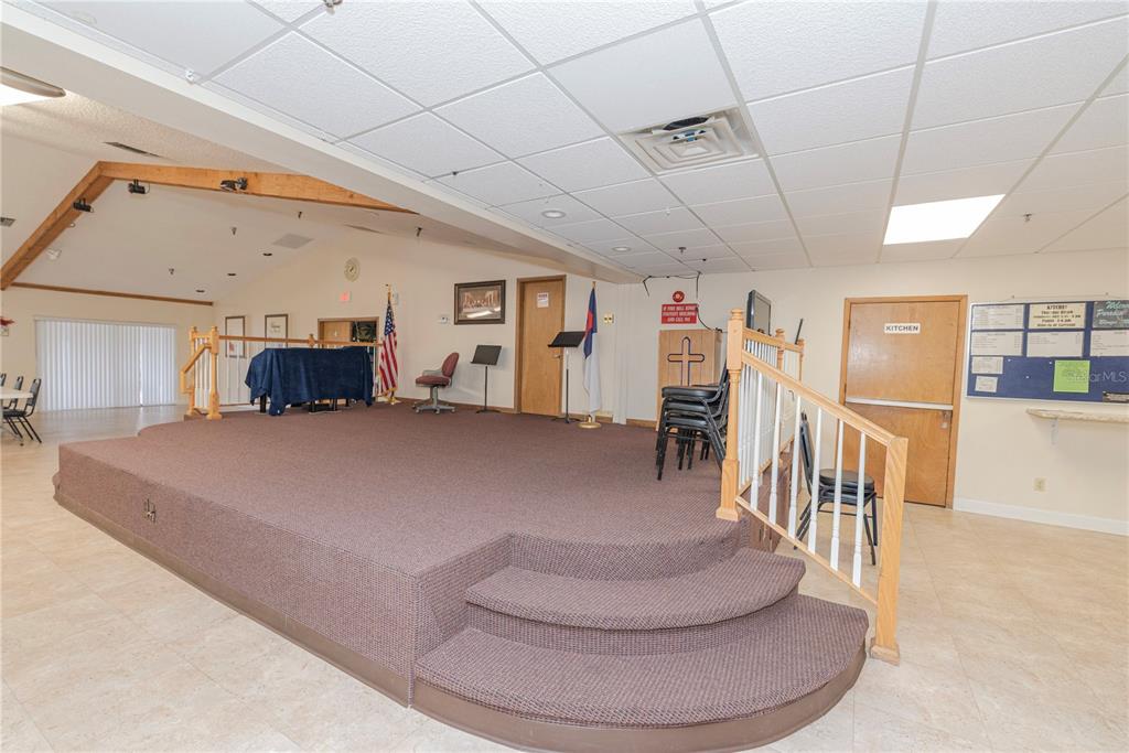 1001 Starkey Road, Unit 767 Largo, FL 33771 - Photo 31 of 41 a living room with furniture and a chandelier