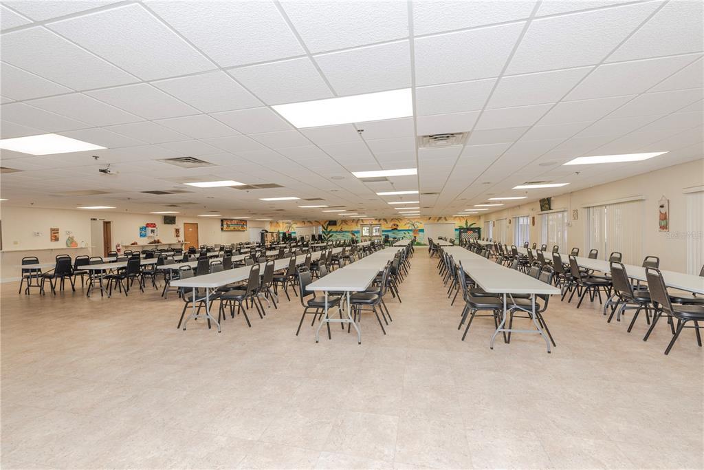 1001 Starkey Road, Unit 767 Largo, FL 33771 - Photo 34 of 41 a group of people sitting at kitchen