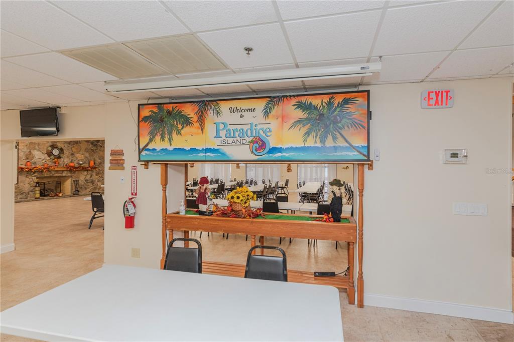 1001 Starkey Road, Unit 767 Largo, FL 33771 - Photo 36 of 41 a kitchen with stainless steel appliances granite countertop a refrigerator and a window