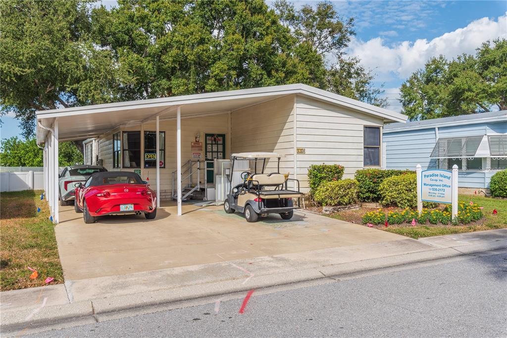 1001 Starkey Road, Unit 767 Largo, FL 33771 - Photo 39 of 41 a view of a car parked in front of a house