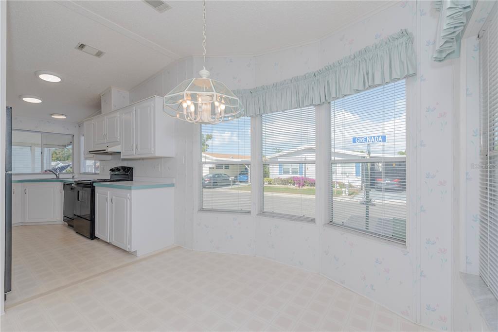 1001 Starkey Road, Unit 767 Largo, FL 33771 - Photo 4 of 41 a view of a kitchen with refrigerator and windows