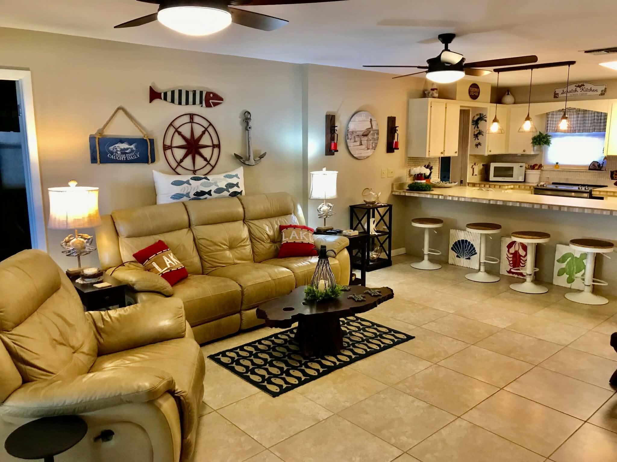 1115 Elm Street Okeechobee, FL 34974 - Photo 9 of 37 a living room with furniture and a table
