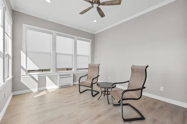 a view of a kitchen from the hallway with a washer and dryer