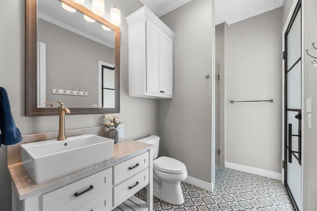 a work room with furniture and a large window