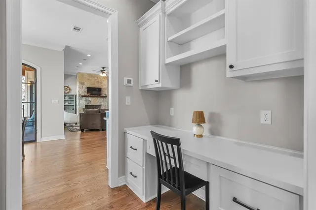 a view of a livingroom with furniture window and wooden floor