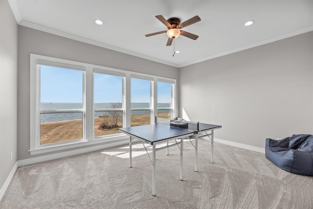 3016 Lake Ridge Drive Streetman, TX 75859 - Photo 27 of 40 Moving upstairs you'll find the first of 2 bonus areas! This room overlooks the lake and is great as a game room, or second living area!
