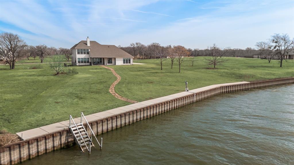 3016 Lake Ridge Drive Streetman, TX 75859 - Photo 3 of 40 With a steel retaining wall in place already...all you need to do is add in your dream boathouse and be ready for fun!