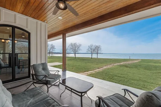 a bathroom with a granite countertop sink a toilet and a mirror