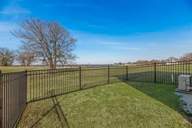 a view of a swimming pool with a couches in a patio