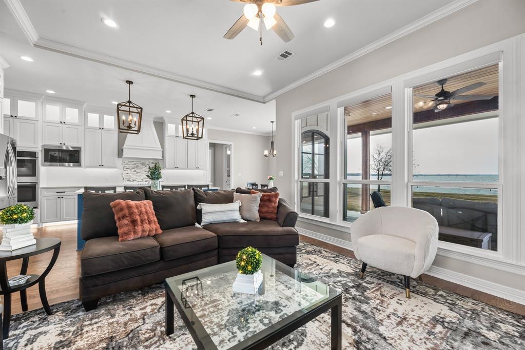 3016 Lake Ridge Drive Streetman, TX 75859 - Photo 7 of 40 The living room flows seamlessly into all of the other rooms from here, while affording you the incredible open water views!