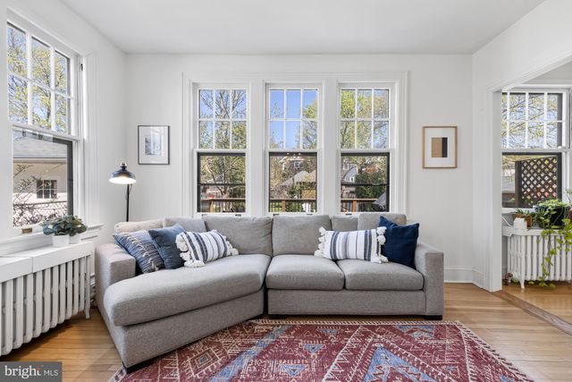 a kitchen with granite countertop a sink stove and cabinets