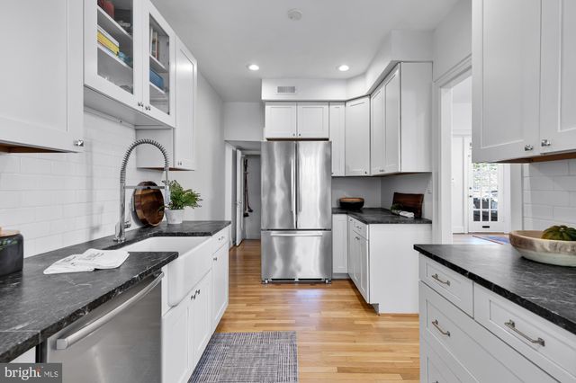 a bed room with a bed and a window