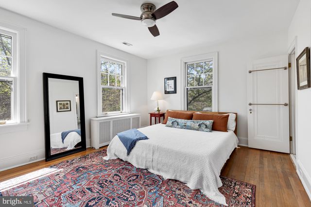 a bathroom with a sink mirror and a shower