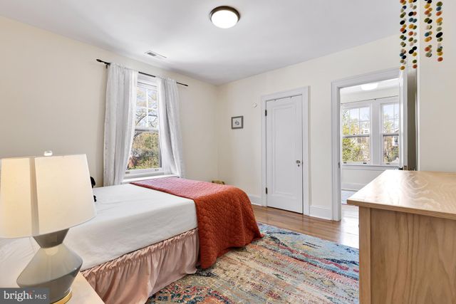 a living room with furniture rug and window
