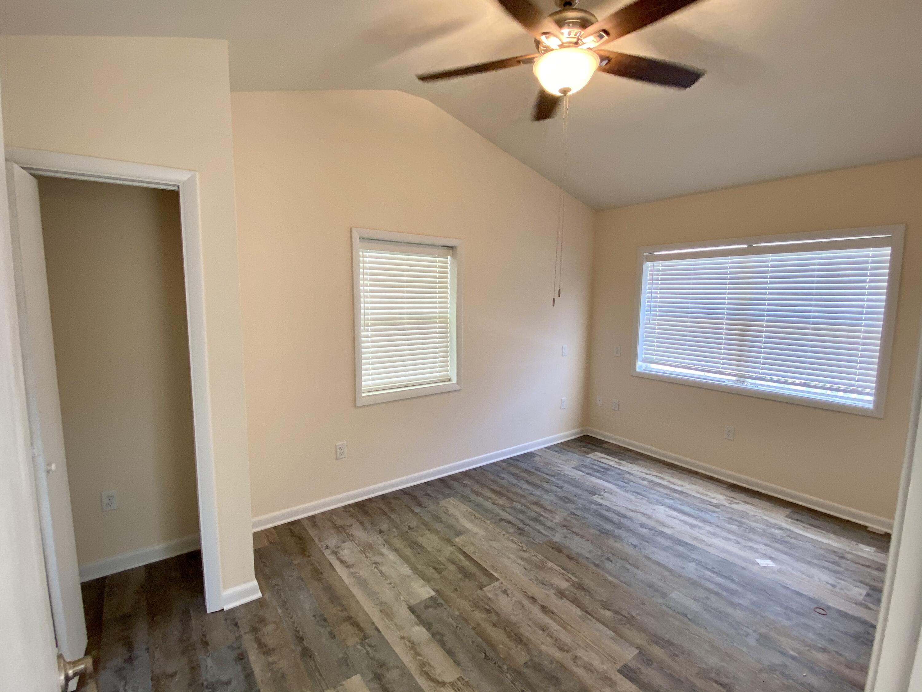 41 Bramble Street Santa Rosa Beach, FL 32459 - Photo 11 of 15 a view of an empty room with wooden floor and a window