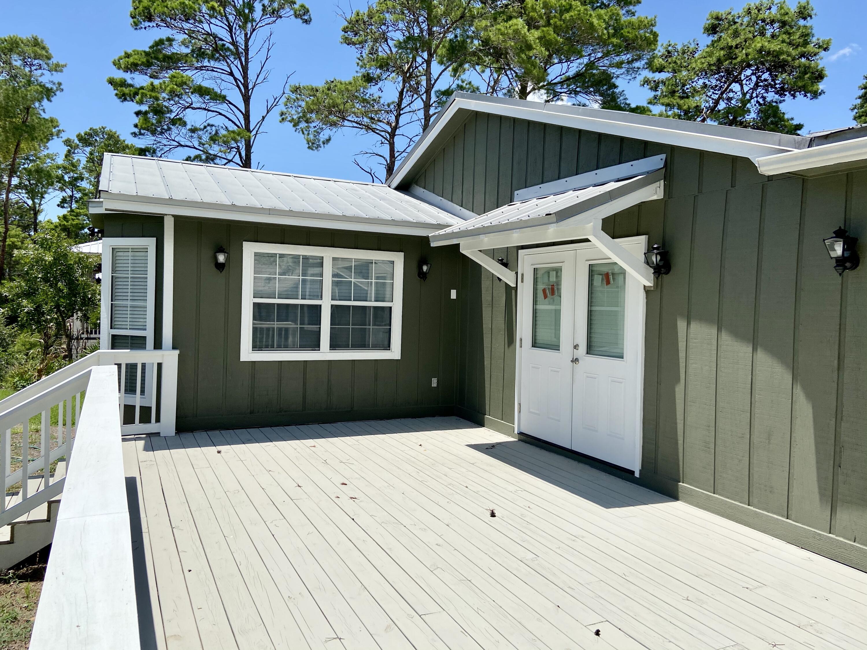 41 Bramble Street Santa Rosa Beach, FL 32459 - Photo 2 of 15 a front view of a house with a porch
