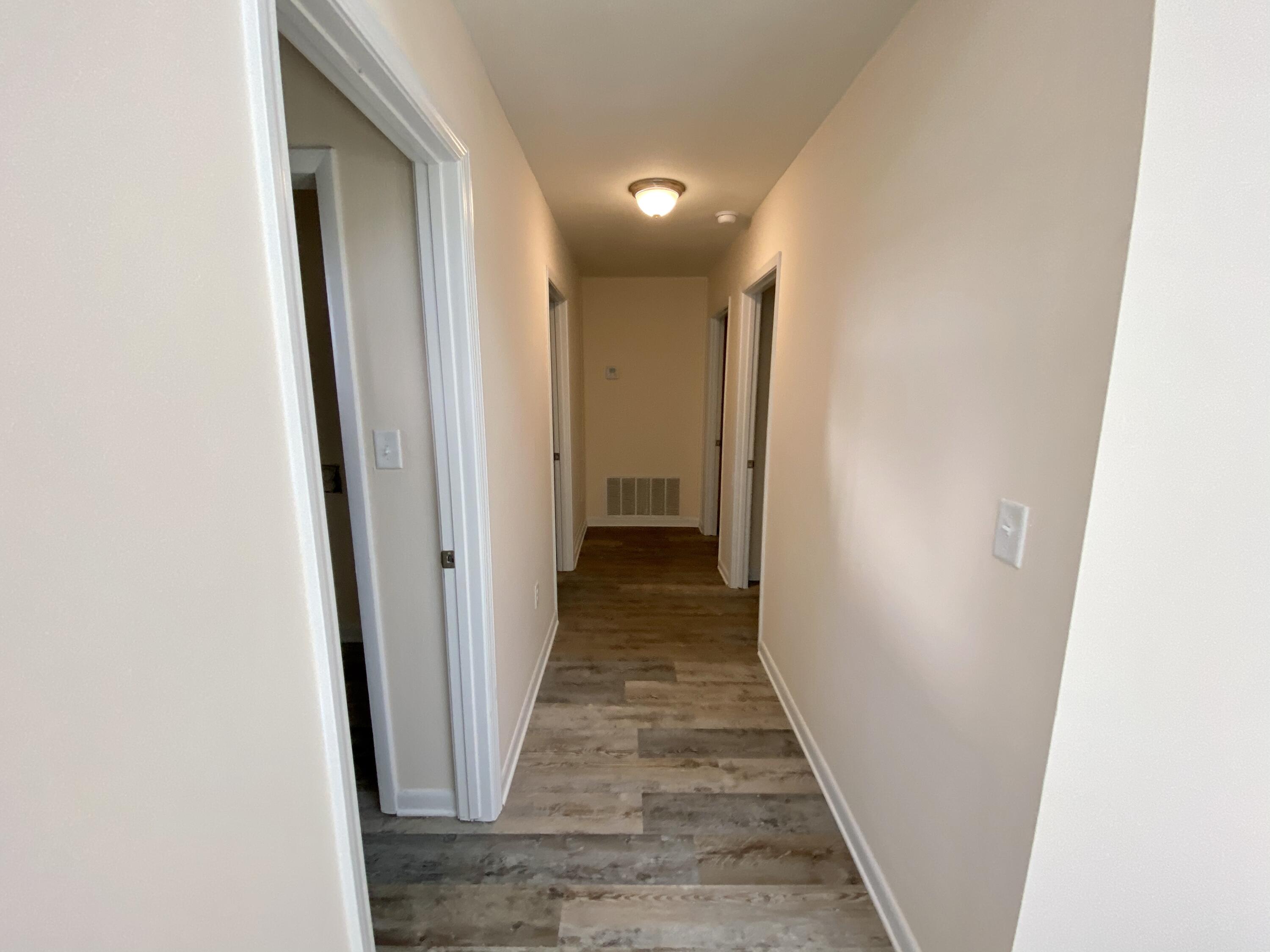 41 Bramble Street Santa Rosa Beach, FL 32459 - Photo 7 of 15 a view of a hallway with wooden floor