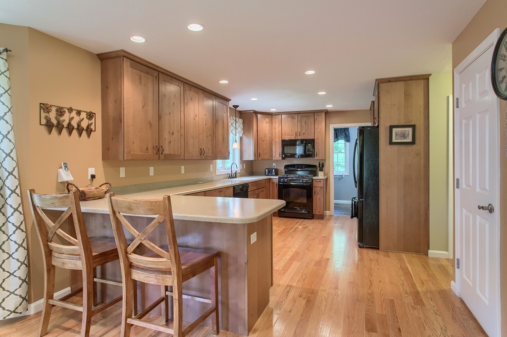 16 Adams Road Townsend, MA 01469 - Photo 4 of 30 a kitchen with stainless steel appliances granite countertop a refrigerator and a stove top oven
