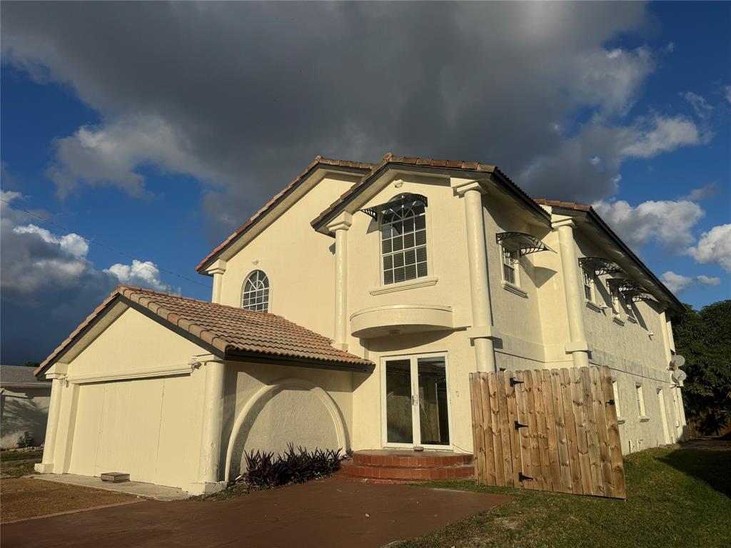 472 Northwest 2nd Terrace, Unit A Deerfield Beach, FL 33441 - Photo 1 of 5 a view of a large white building