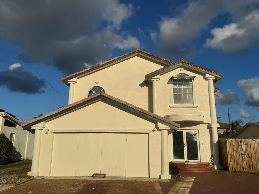 472 Northwest 2nd Terrace, Unit A Deerfield Beach, FL 33441 - Photo 2 of 5 a view of a house with a street