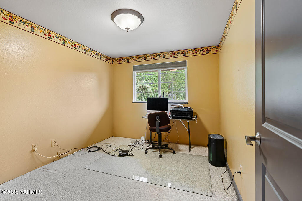 250 Hexon Road Selah, WA 98942 - Photo 26 of 50 a view of a workspace with furniture and a window