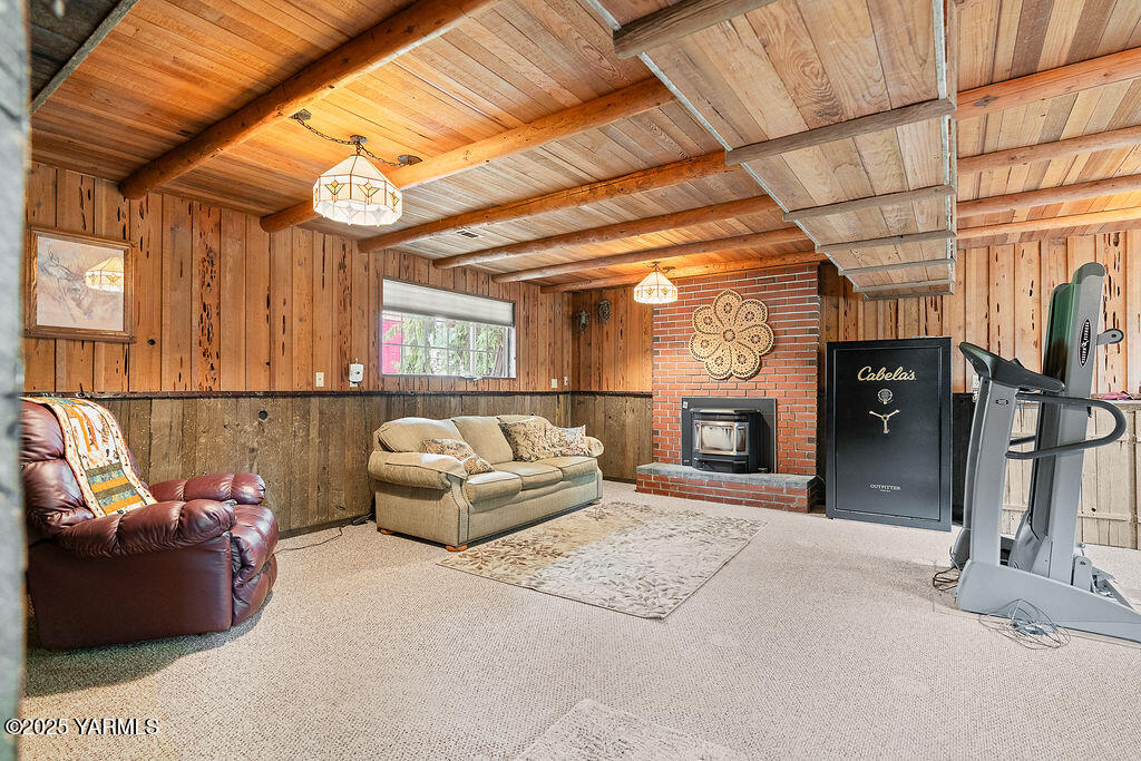 250 Hexon Road Selah, WA 98942 - Photo 30 of 50 a living room with furniture a fireplace and a large window