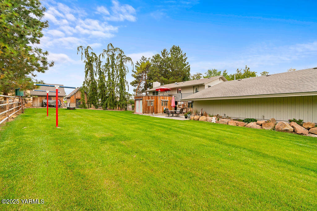 250 Hexon Road Selah, WA 98942 - Photo 41 of 50 a view of a lake with a house in the background