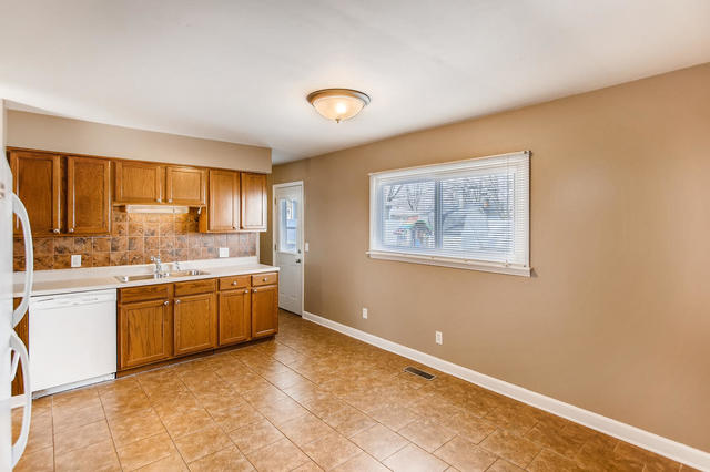 67 Saugatuck Road Montgomery, IL 60538 - Photo 2 of 17 a large kitchen with stainless steel appliances granite countertop a stove a sink dishwasher and a refrigerator