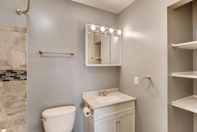 67 Saugatuck Road Montgomery, IL 60538 - Photo 11 of 17 a bathroom with a toilet sink and mirror