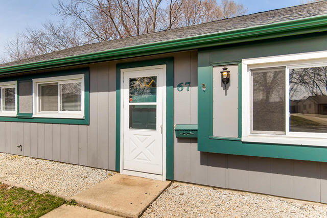 67 Saugatuck Road Montgomery, IL 60538 - Photo 14 of 17 a front view of a house with a yard