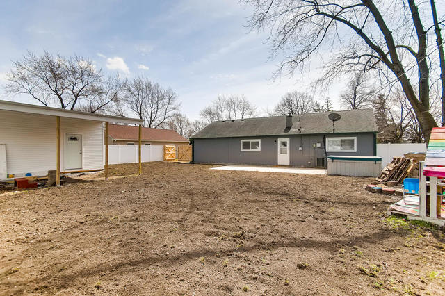 67 Saugatuck Road Montgomery, IL 60538 - Photo 15 of 17 a view of a house with a yard and garage