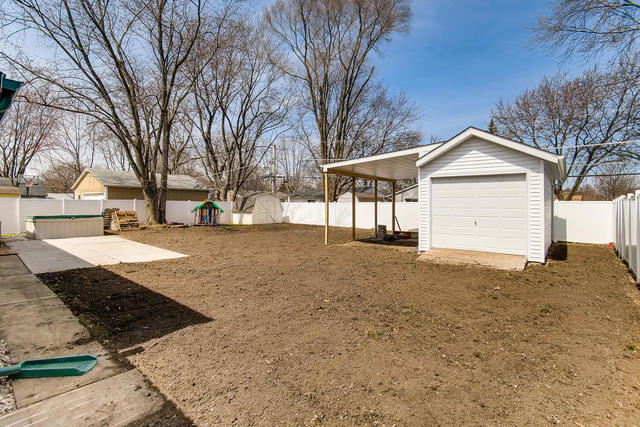 67 Saugatuck Road Montgomery, IL 60538 - Photo 17 of 17 a view of a house with a yard covered in snow