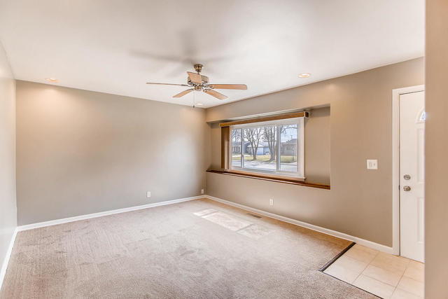 67 Saugatuck Road Montgomery, IL 60538 - Photo 6 of 17 a view of an empty room with a window