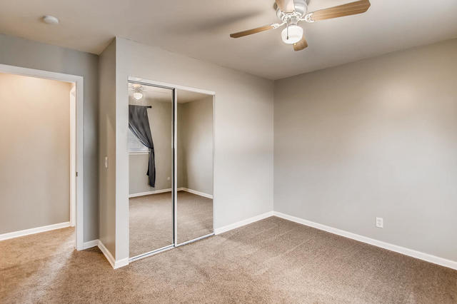 67 Saugatuck Road Montgomery, IL 60538 - Photo 8 of 17 an empty room with a chandelier fan and closet