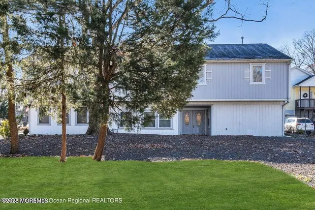 a backyard of a house with lots of green space