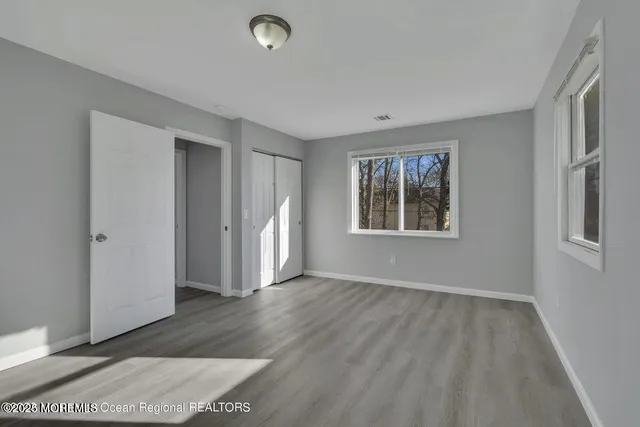 a view of dirt yard with a tree