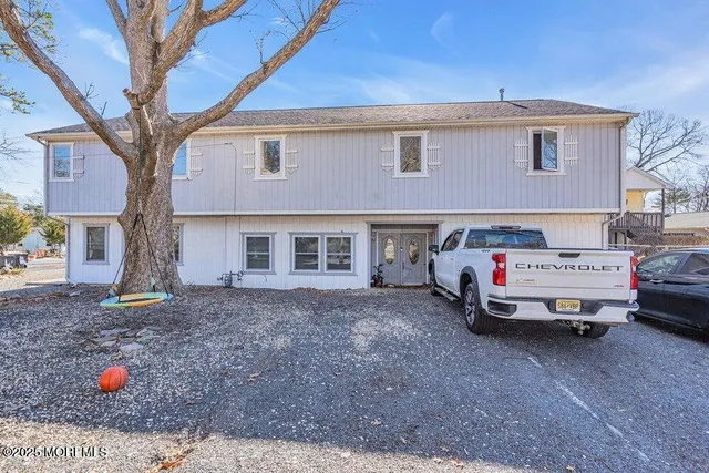 a car parked in front of a house