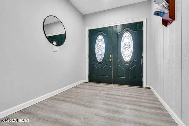 a view of entryway with wooden floor