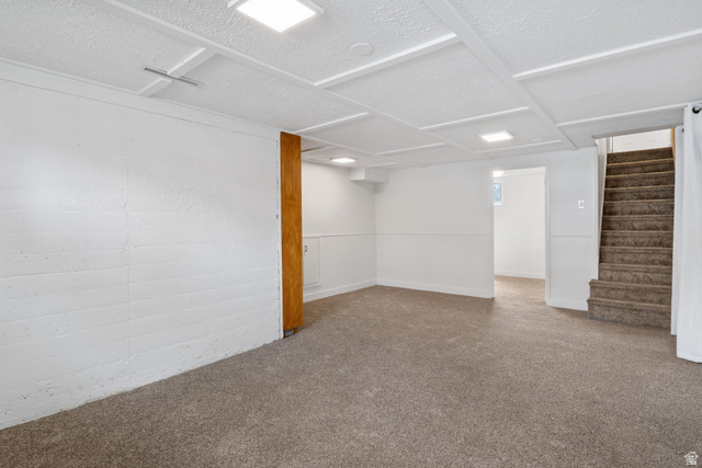 141 South 400 East Logan, UT 84321 - Photo 21 of 41 Finished basement with stairs and carpet flooring