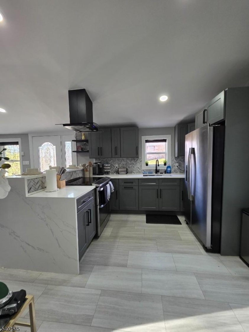8 Warren Lane Wantage, NJ 07461 - Photo 3 of 11 a large kitchen with a large counter top stainless steel appliances and cabinets
