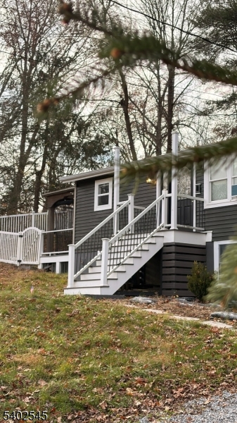 8 Warren Lane Wantage, NJ 07461 - Photo 7 of 11 a front view of a house with a yard balcony