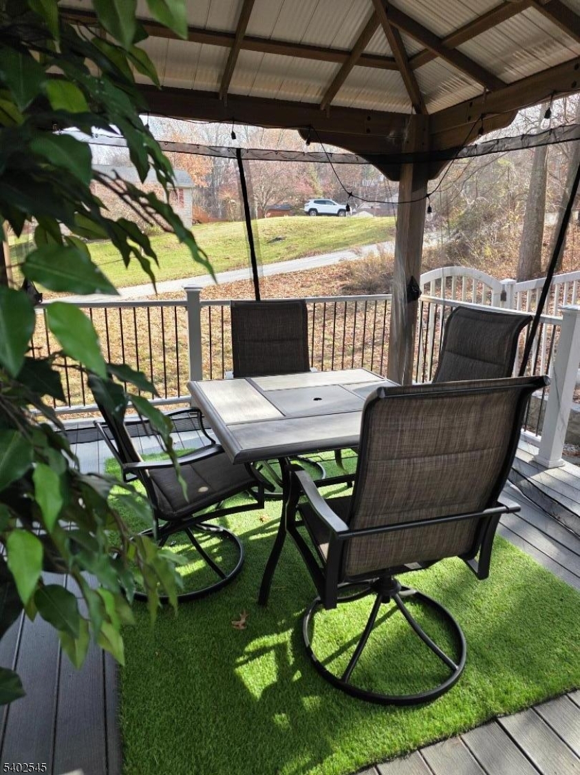 8 Warren Lane Wantage, NJ 07461 - Photo 8 of 11 a backyard of a house with table and chairs