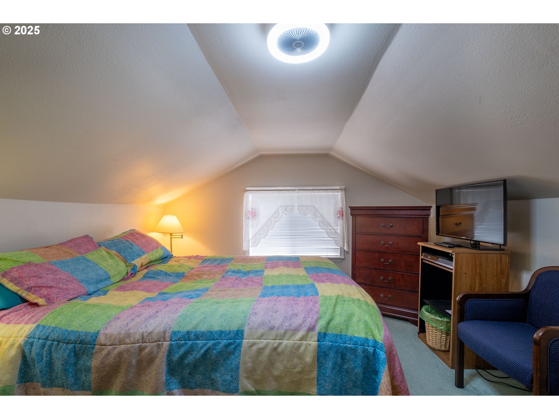 318 Highway 101 Depoe Bay, OR 97341 - Photo 24 of 47 a bedroom with a bed and a television