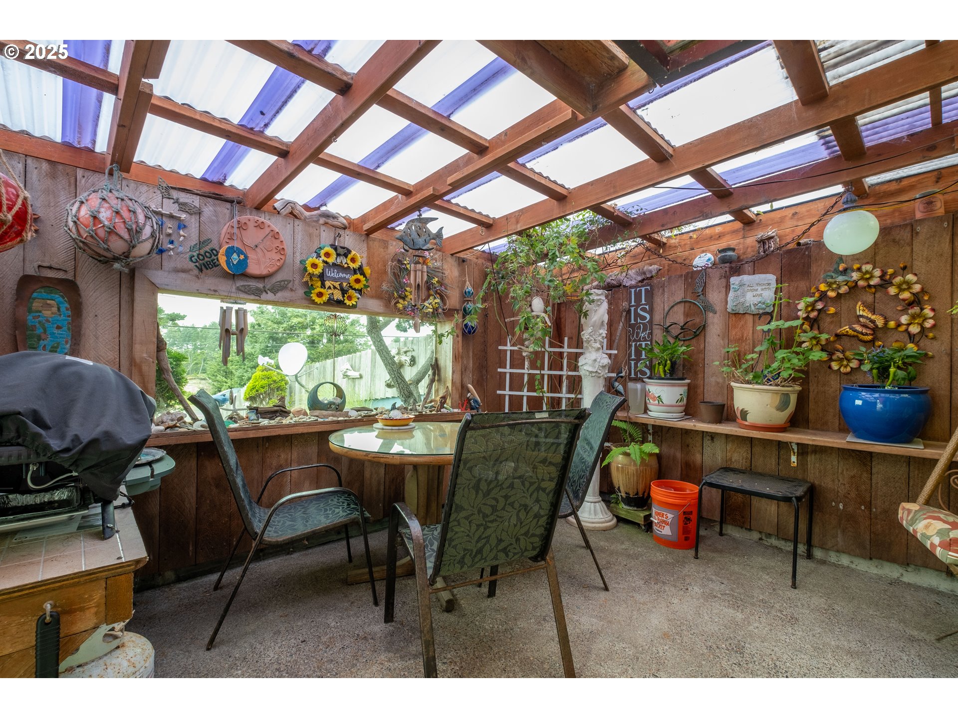 318 Highway 101 Depoe Bay, OR 97341 - Photo 27 of 47 a dining room with furniture and a floor to ceiling window