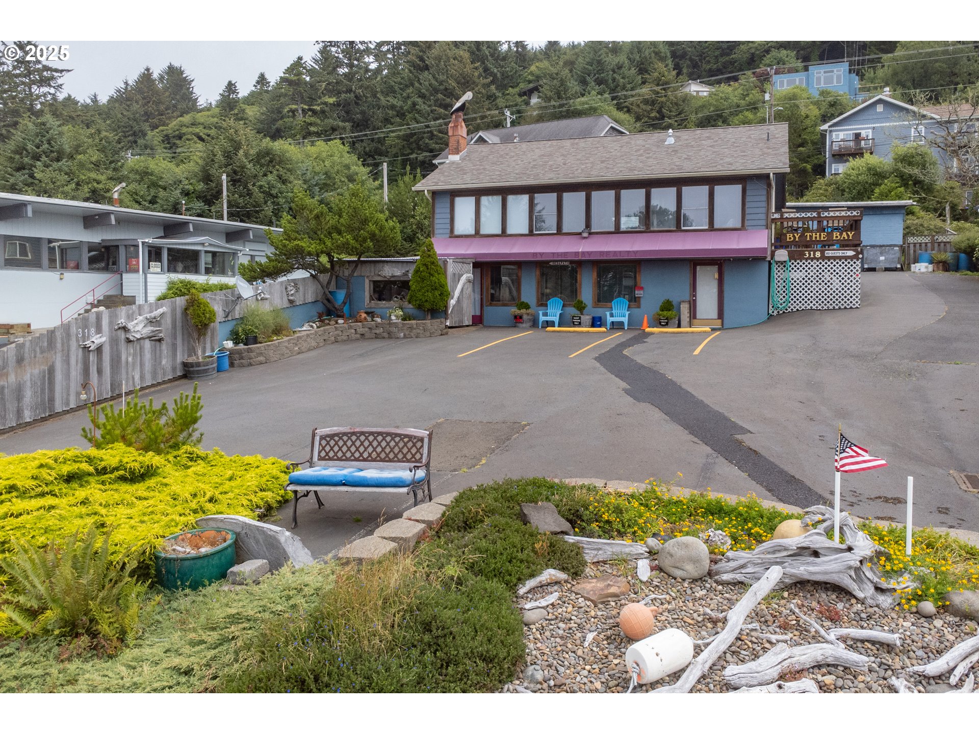 318 Highway 101 Depoe Bay, OR 97341 - Photo 3 of 47 a front view of a house with a yard