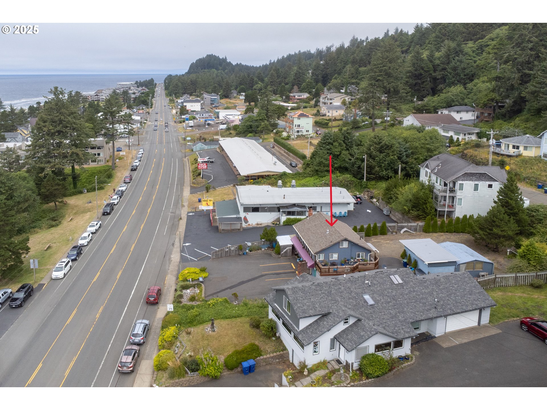 318 Highway 101 Depoe Bay, OR 97341 - Photo 5 of 47 an aerial view of a house with a garden