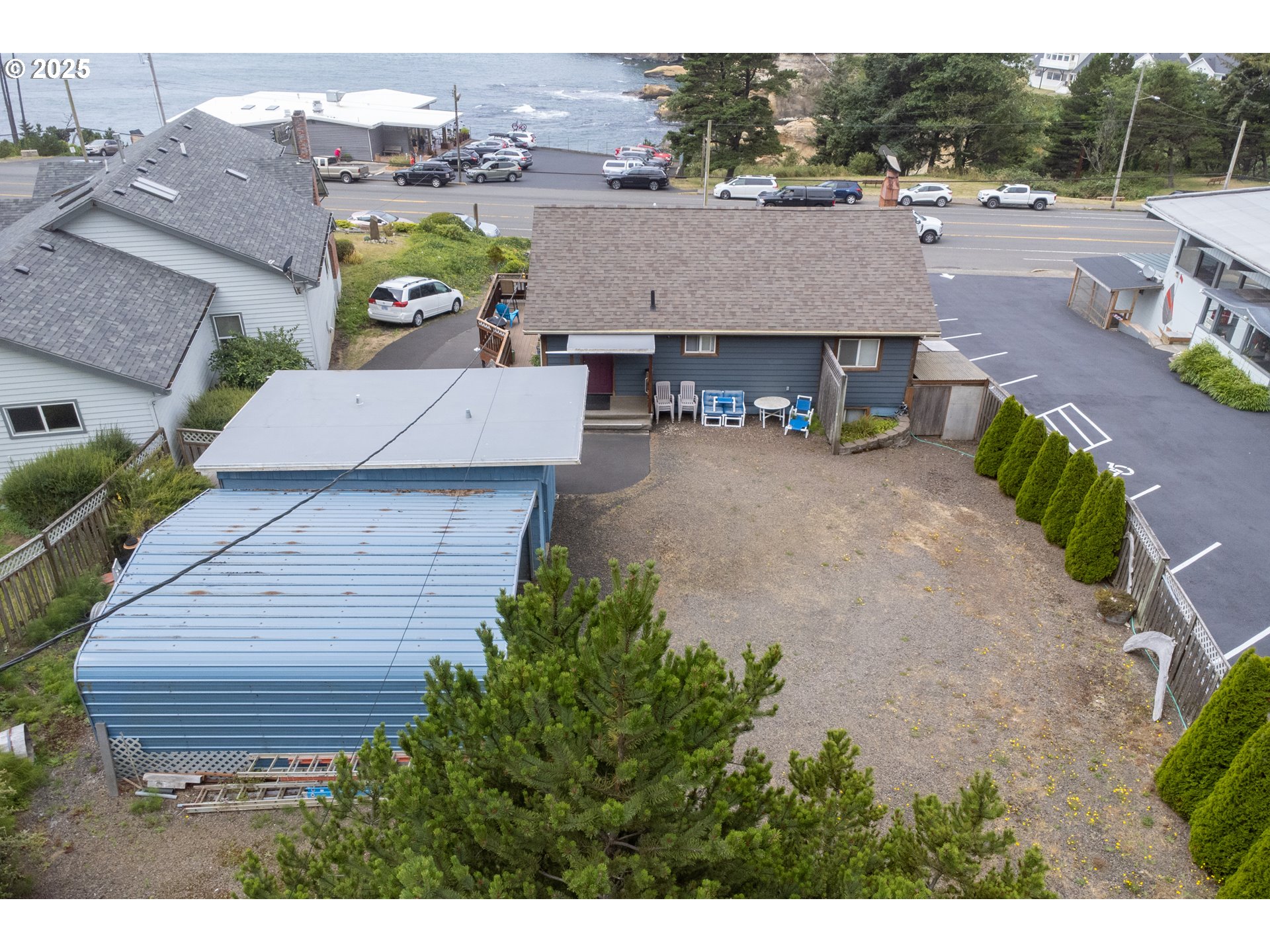 318 Highway 101 Depoe Bay, OR 97341 - Photo 6 of 47 an aerial view of a house with a yard garage and a yard