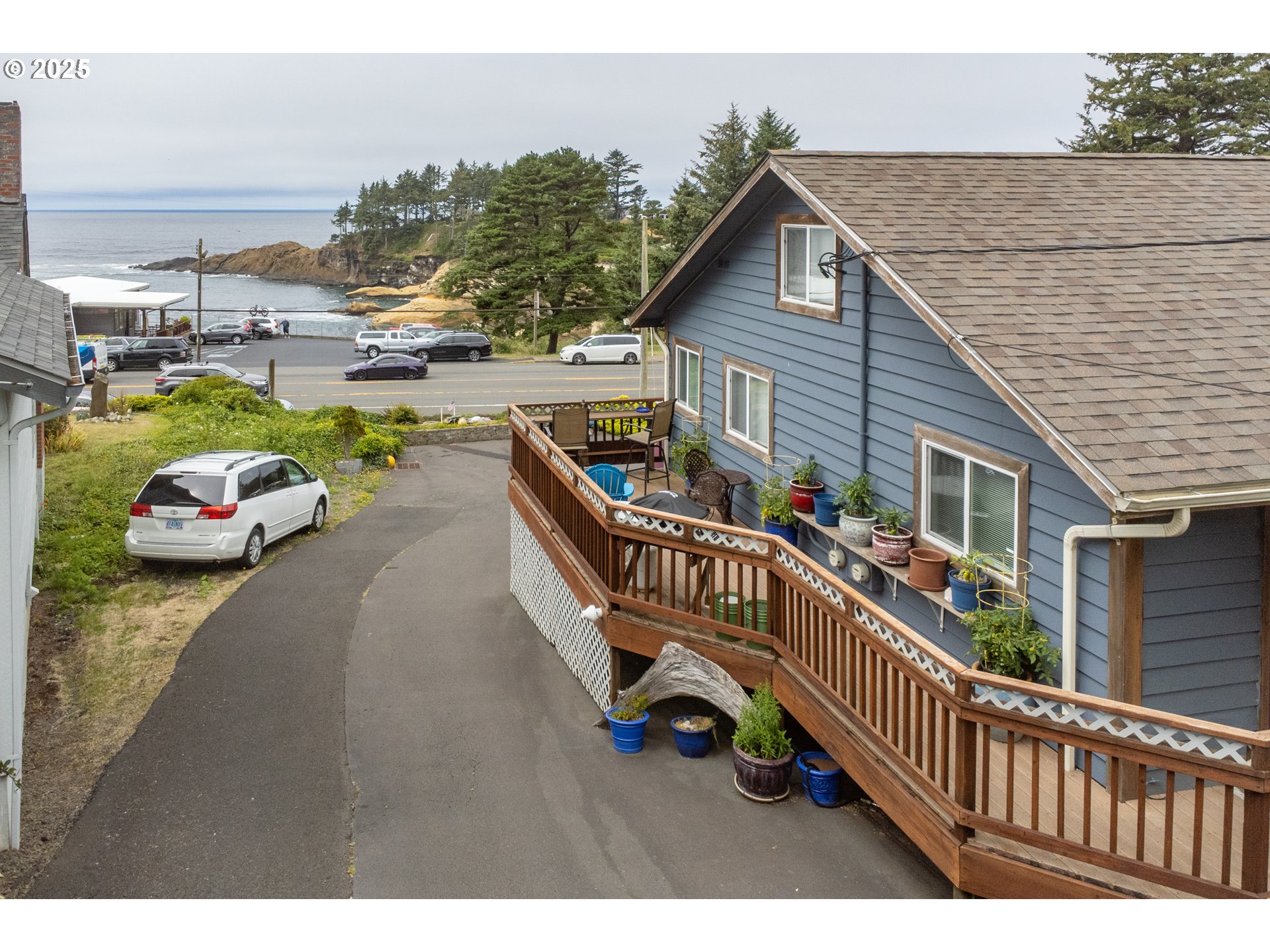 318 Highway 101 Depoe Bay, OR 97341 - Photo 7 of 47 a view of a roof deck with table and chairs