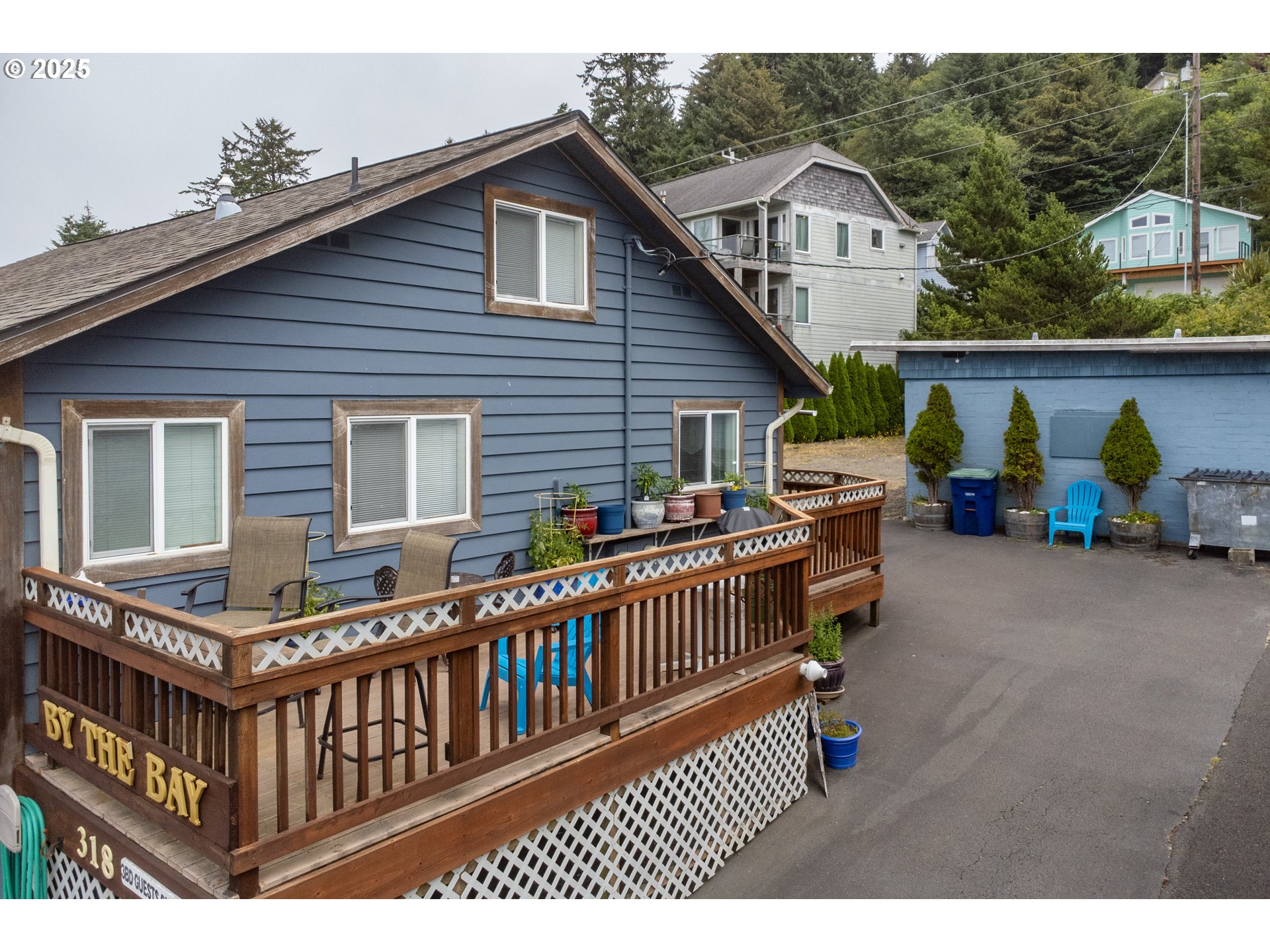 318 Highway 101 Depoe Bay, OR 97341 - Photo 8 of 47 a view of a house with a deck and furniture