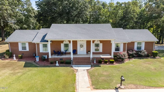 a house view with sitting space and garden space